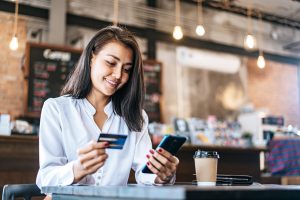 Pay Goods By Credit Card Through Smartphone Coffee Shop Scaled