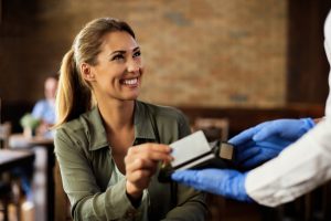 Young Happy Woman Paying With Credit Card Cafe Scaled